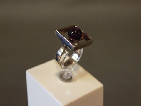 Edged ring in 925 sterling silver with purple rock, stamped MPC by 
M.P.Christoffersen.
5000m2 showroom.
