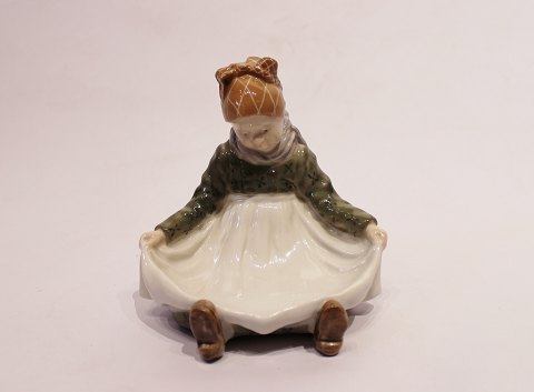 Royal Copenhagen porcelain figure, sitting girl, no.: 1315.
5000m2 showroom.