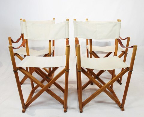 Set of four folding chairs, model MK99200, by Mogens Koch of beech and light 
nature canvas.
5000m2 showroom.