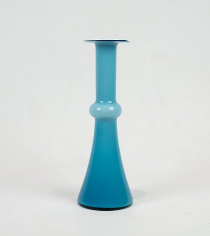 Blus glass vase with White opal glass on the insidefrom the series "Carnaby" by 
Holmegaard.
5000m2 showroom.