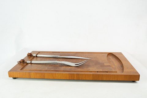Carving board in teak and matching carving set in steel by Digsmed, Denmark.
5000m2 showroom.
