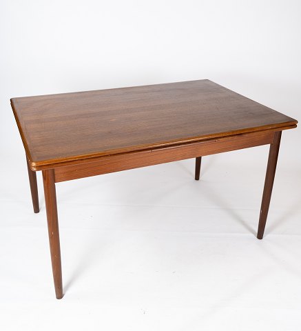 Dining table in teak with extensions of danish design from the 1960s. 
5000m2 showroom.