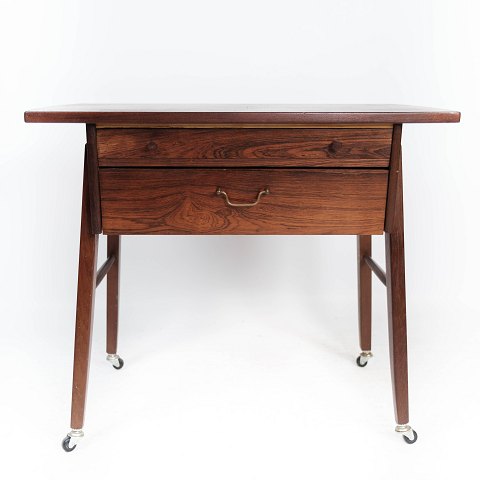Side table in rosewood on wheels of danish design from the 1960s. 
5000m2 showroom.