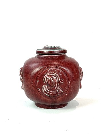 Stoneware lidded vase with ox blood coloured glaze and decorated with relief 
signed Jais Nielsen for Royal Copenhagen. 
5000m2 showroom.
Great condition
