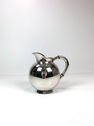Water jug of hallmarked silver decorated with ebony. 
5000m2 showroom.
Great condition
