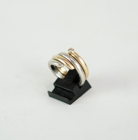 Two in a ring, 14 carat, red and white gold, rustic finish
Great condition
