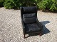 Recliner / wing chair in black leather Danish design from the 1960s stands as a 
new 5000 m2 showroom
