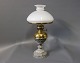 Kerosene table lamp with an iron/brass foot and White glass dome.
5000m2 showroom.
