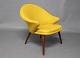 Nanna Ditzel armchair upholstered in yellow fabric and legs of teak.
5000m2 showroom.