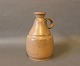 Light brown ceramic jug by the danish artist Kis Lunn.
5000m2 showroom.