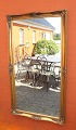 Large mirror with a gilded frame from around the 1930s.
5000m2 showroom.
