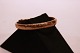 Wide bangle of gilded silver decorated with chisellings.
5000m2 showroom.
