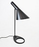 Dark grey table lamp designed by Arne Jacobsen in 1957 and manufactured by Louis 
Poulsen.