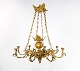 French church chandelier of bronze with beautiful decorations and eight arms for 
candle lights from around the 1880s.
5000m2 showroom.
