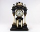 French fireplace clock of marble and bronze, and decorated with ornaments of 
mother of pearl from around the 1840s.
5000m2 showroom.