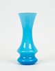 Blue glass vase with white opaline glass on the inside by Holmegaard.
5000m2 showroom.