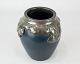 Ceramic vase in dark blue decorated with metal edge by Ibsen Enke.
5000m2 showroom.