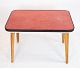 Side table with red laminate of danish design from the 1960s.
5000m2 showroom.