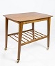 Side table with shelf and on wheels, in teak of danish design from the 1960s. 
5000m2 showroom.