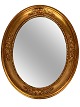 Ovale mirror with frame of leaf gold, from the 1920s. 
5000m2 showroom.
Great condition

