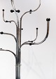Stumtjener i rustfrit stål med ni arme designet af Sidse Werner og fremstillet af Fritz Hansen i 1970erne. 5000m2 udstilling.