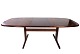 Dining table with extensions in rosewood of danish design manufactured by Skovby from the 1960s.5000m2 showroom.